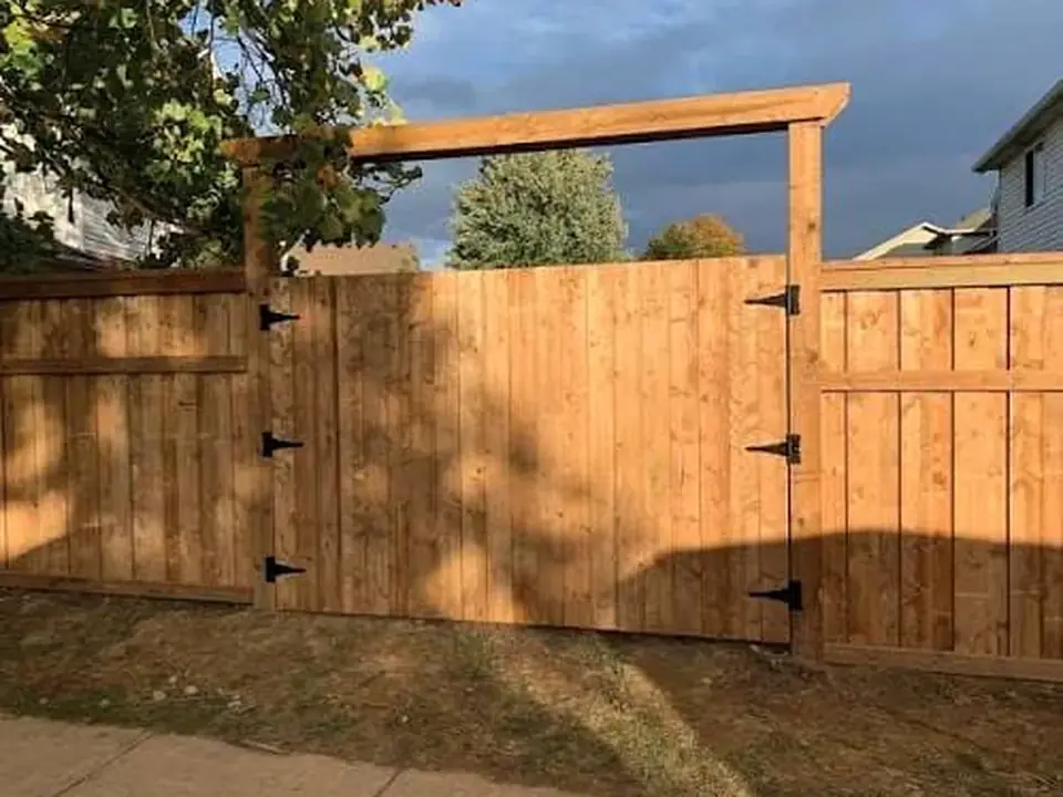 Finished wood double gate with black hardware