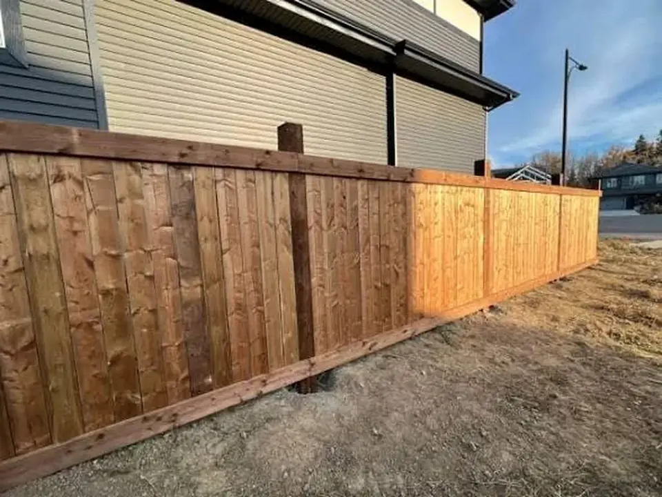Finished wood privacy fence along a residential property