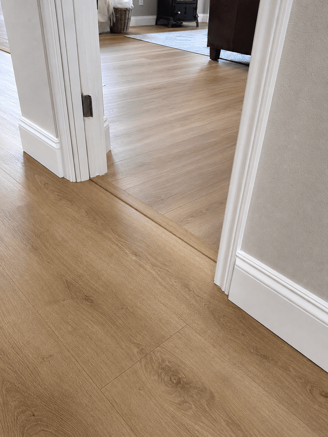 Close view of a clean flooring transition between rooms