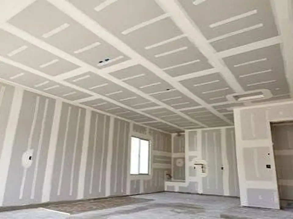 Garage wall and ceiling drywall finishing in progress