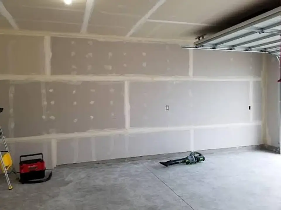 Garage interior with drywall finishing in progress